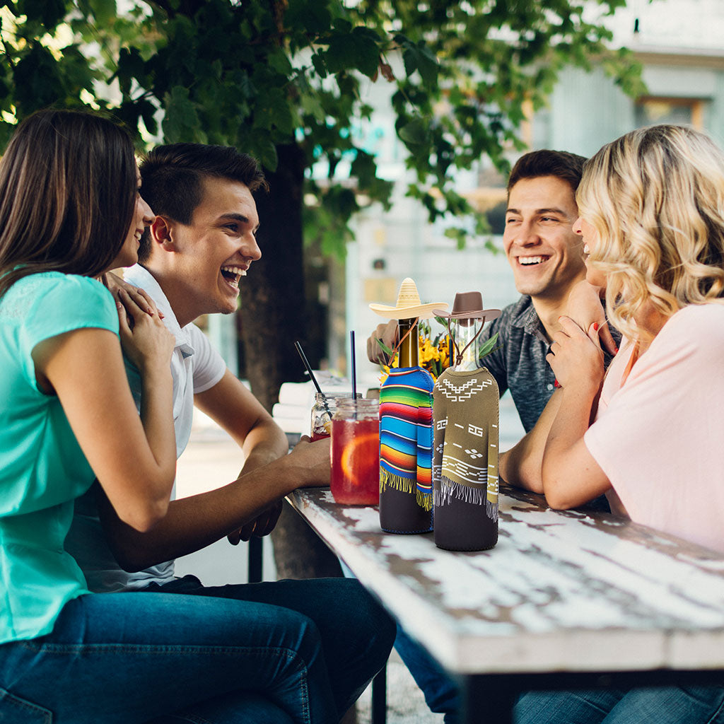 Playful wine bottle covers styled at a picnic or party, perfect for gifting or entertaining.