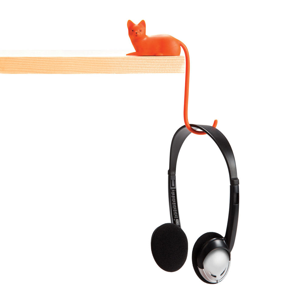 Orange and white cat-shaped hook holding headphone -Monkey Business