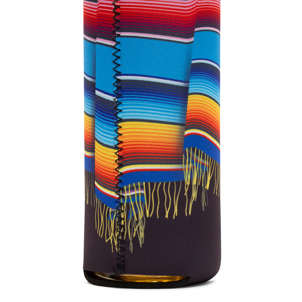 Close-up of textured neoprene surface on poncho sleeves, designed for better grip and temperature control.