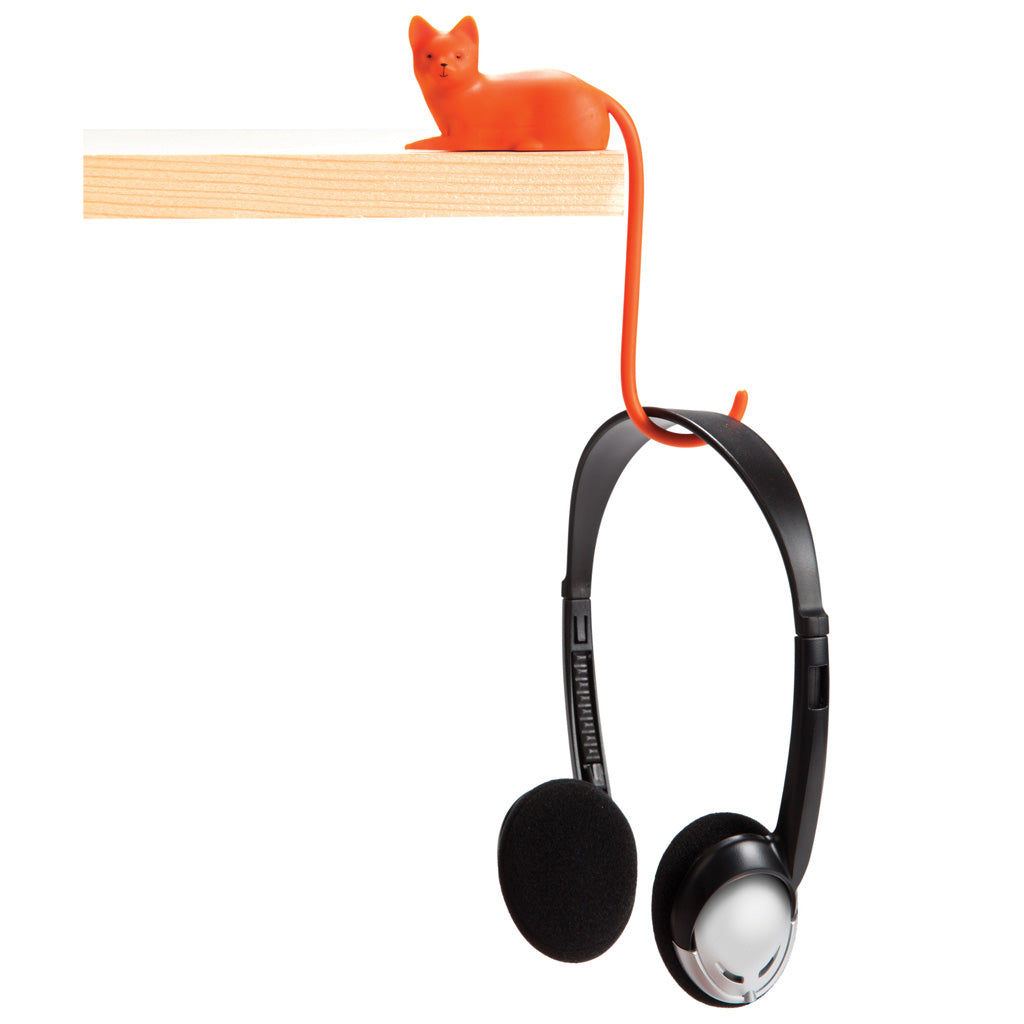 ginger screen hook with 3M adhesive 	Tail-shaped hook hanging from a shelf with a headphone wire by Monkey Business