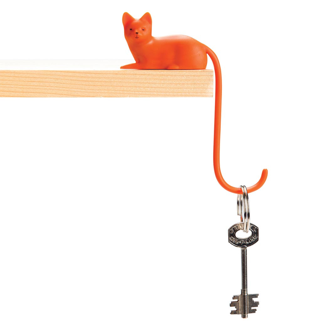 Cat tail cable hook in orange and white on a computer monitorMonkey Business